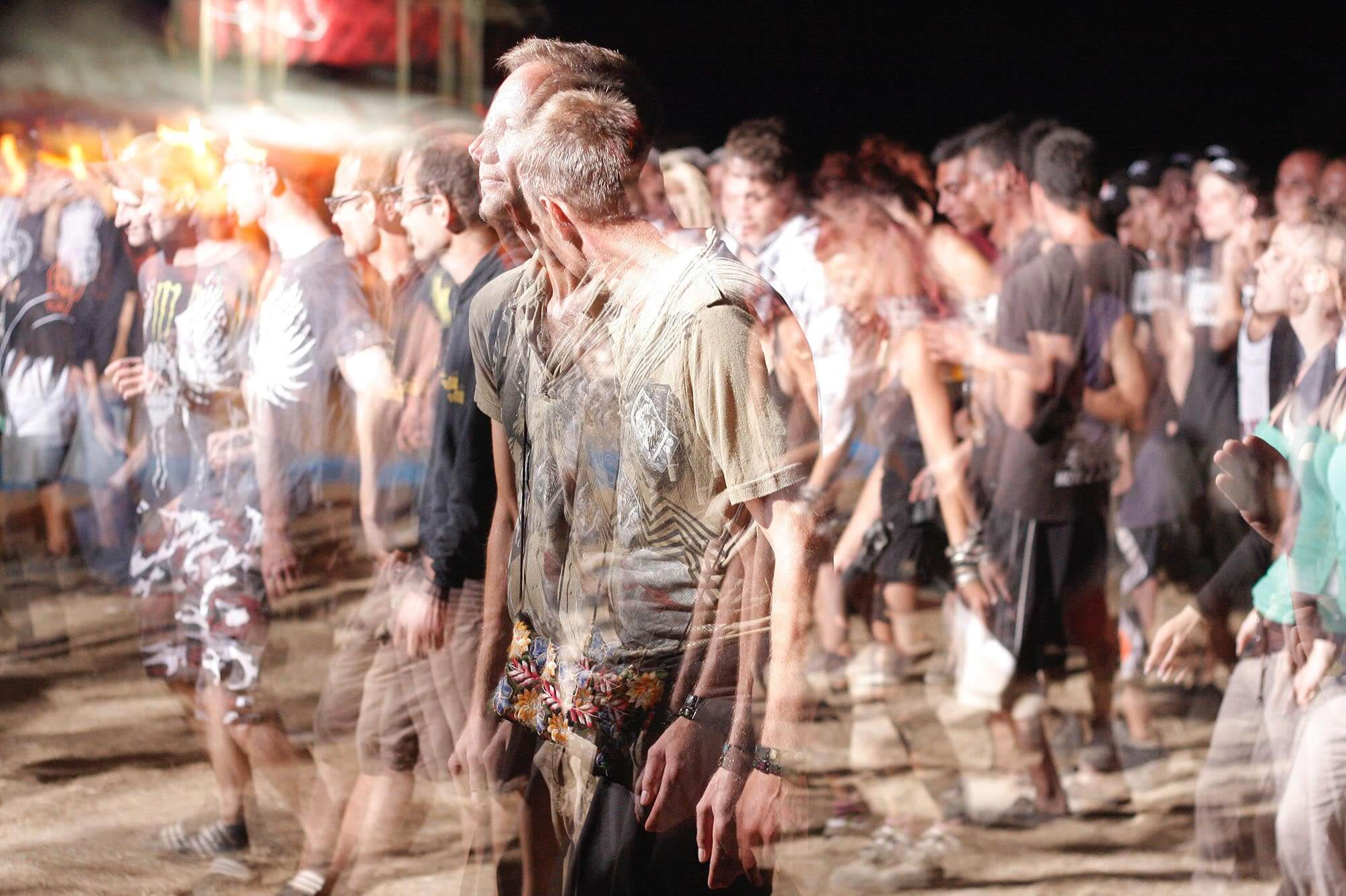 a group of people standing in a crowd