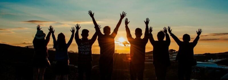 a group of people with their hands up