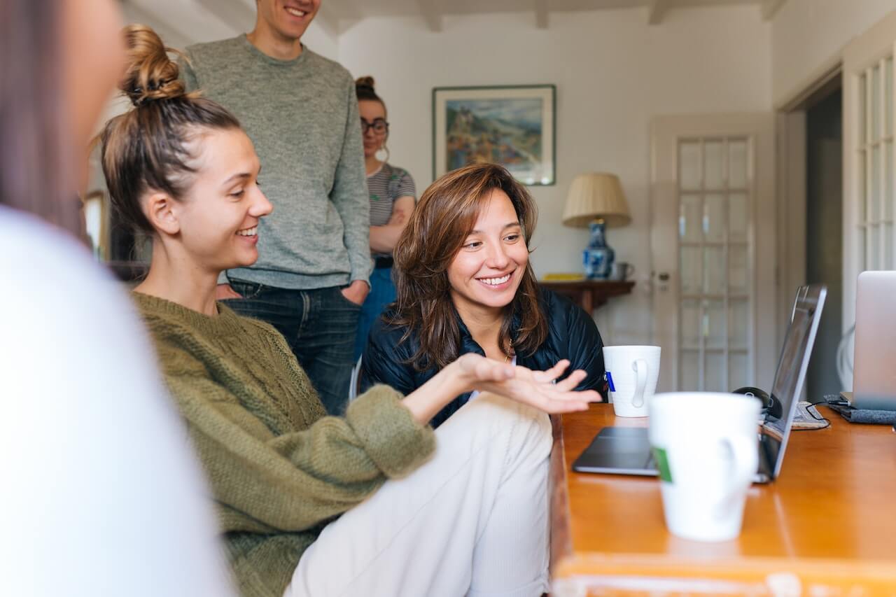 a group of people sitting at a table