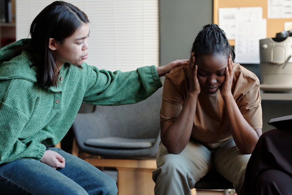 Comforting upset young woman