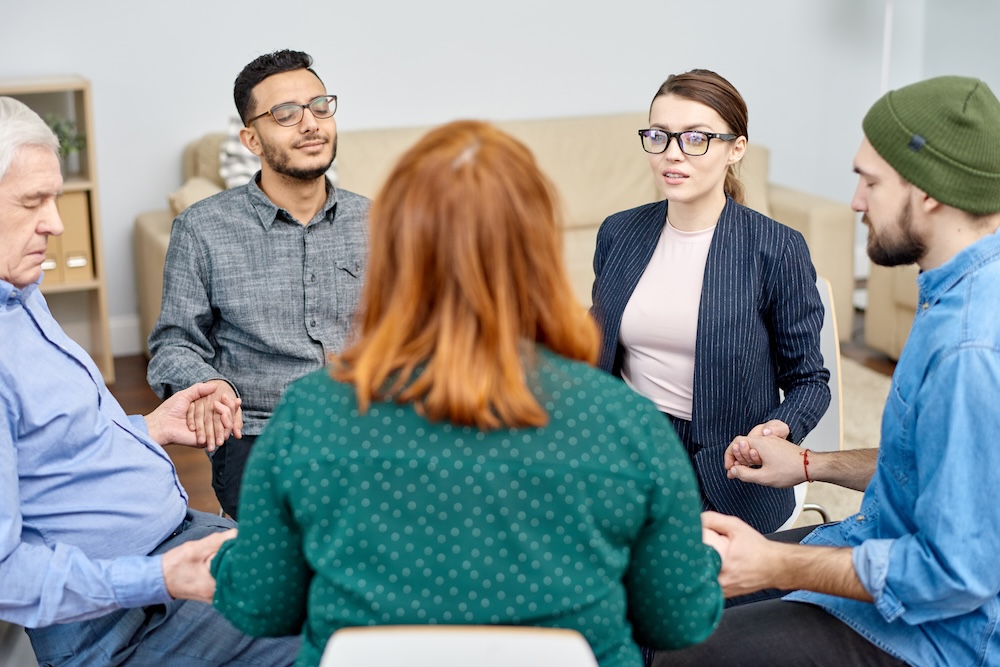 Support Group Holding Hands