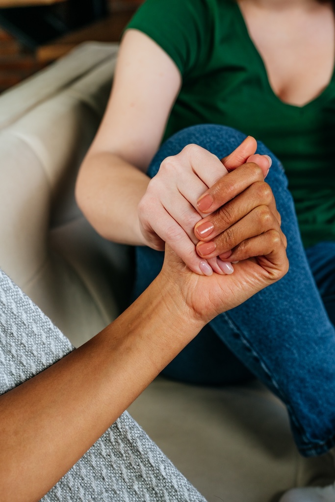 Therapist holding clients hand