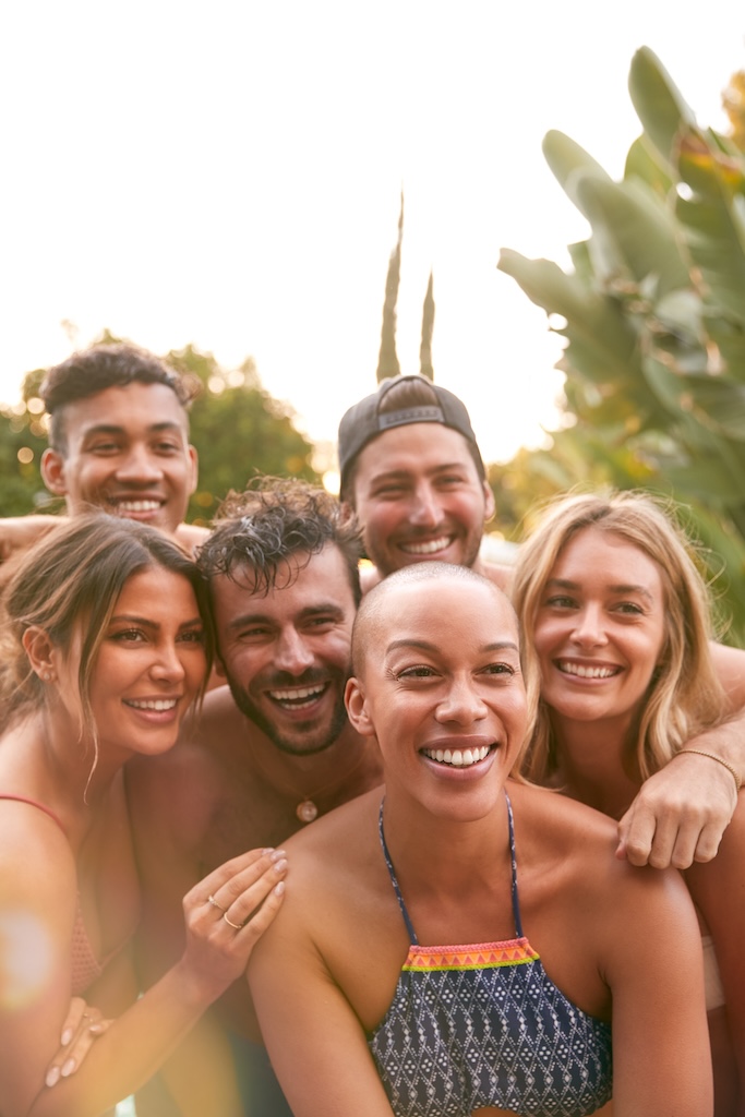 Portrait of friends in recovery smiling and posing together in California