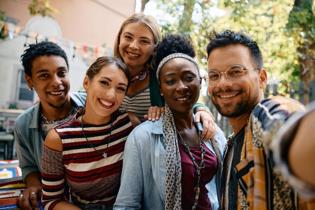 Group of young happy people taking selfie i