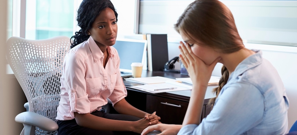 Doctor In Consultation With Depressed Female Patient